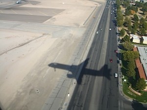 an airplane shadow on the road